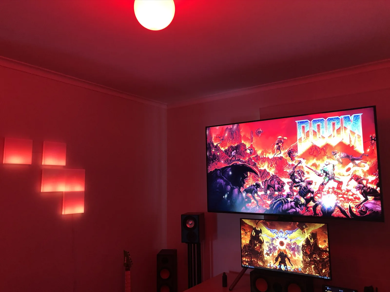 A theatre room with DOOM on the TV and red lighting.