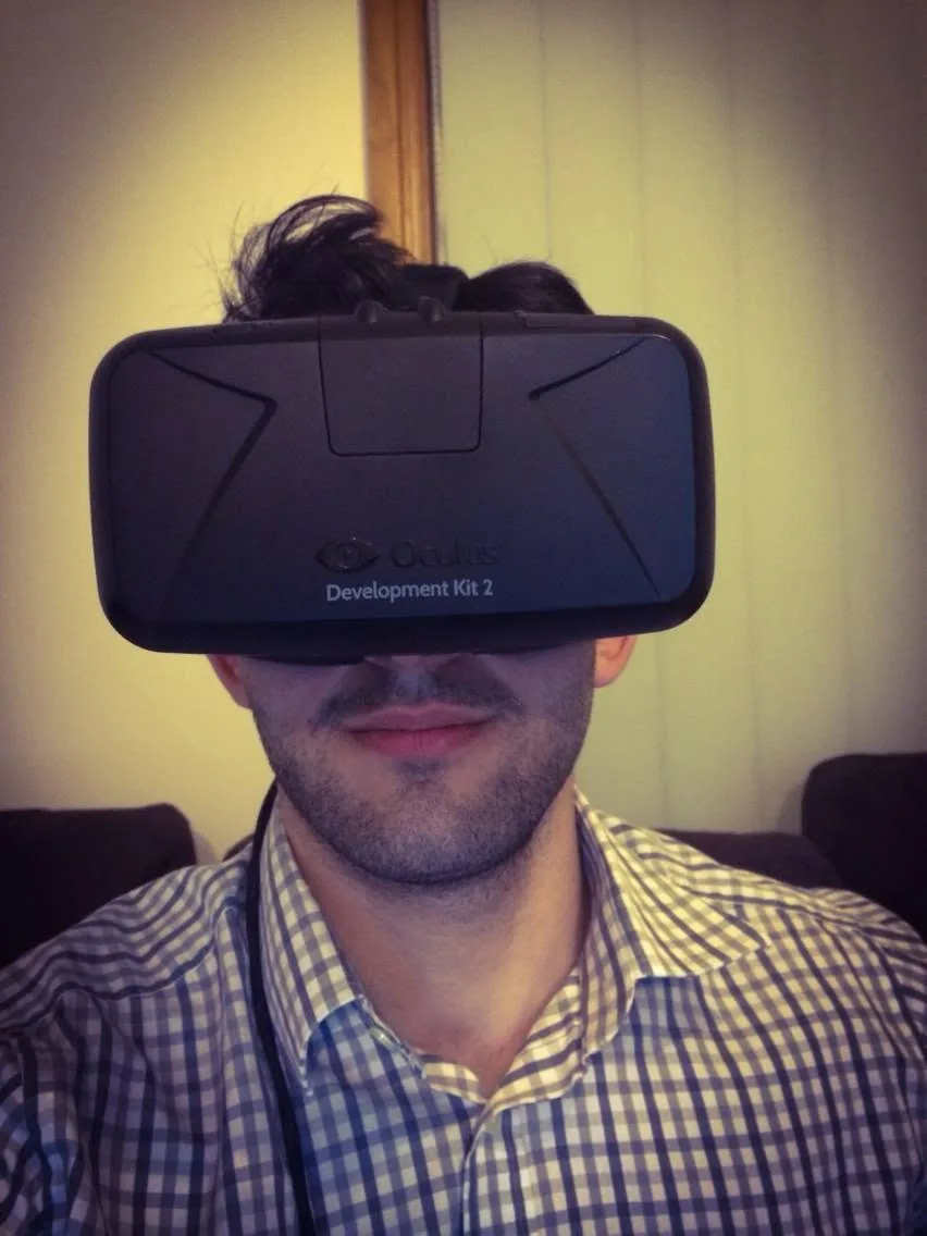 Wearing the Oculus DK2 development kit.