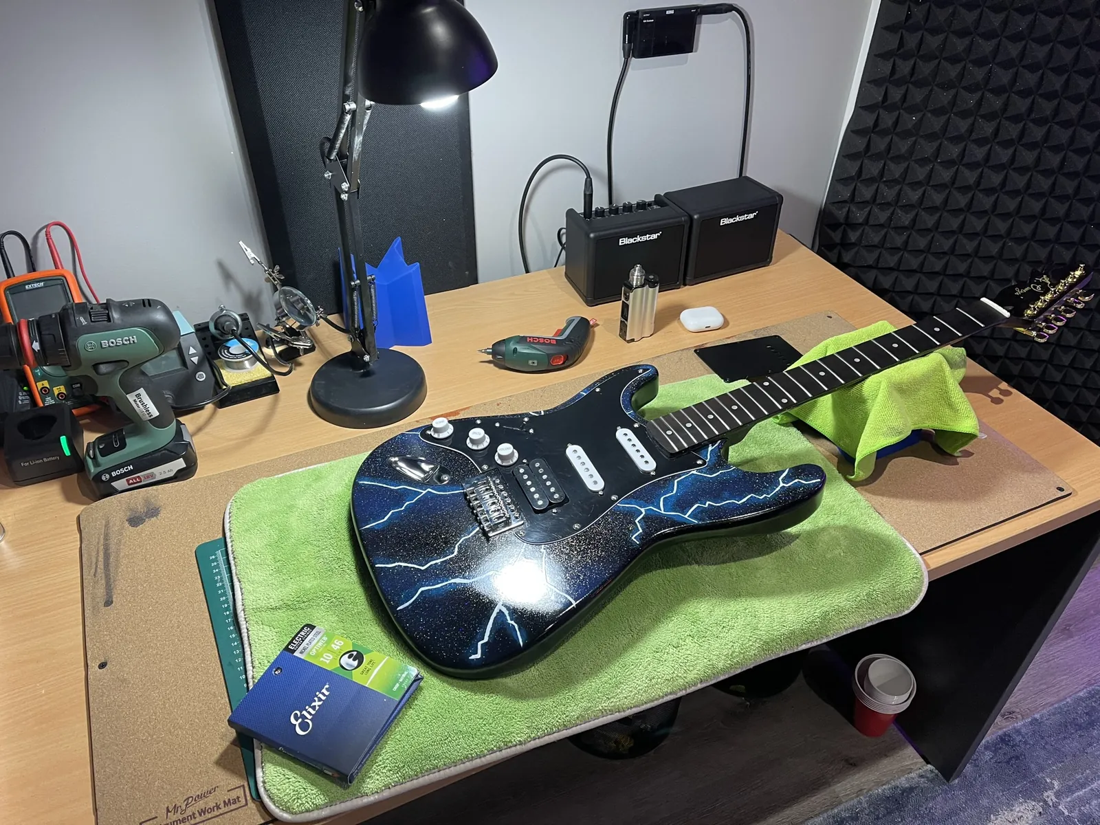 Strat-style build with a lightning graphic finish.